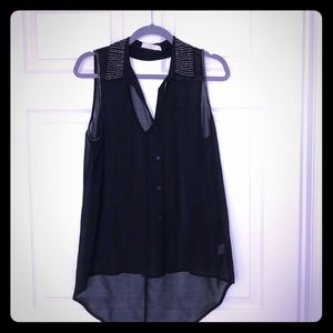 Sleeveless black button down with sparkle detail